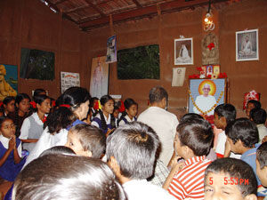 Ajitbhai and Anitaben leading the evening all-faith religious Prayers